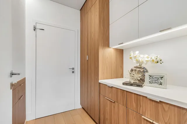 a bedroom with a bed and a chair