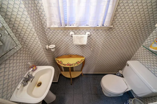 a bathroom with a toilet and a sink