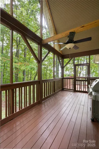 a view of porch with wooden floor