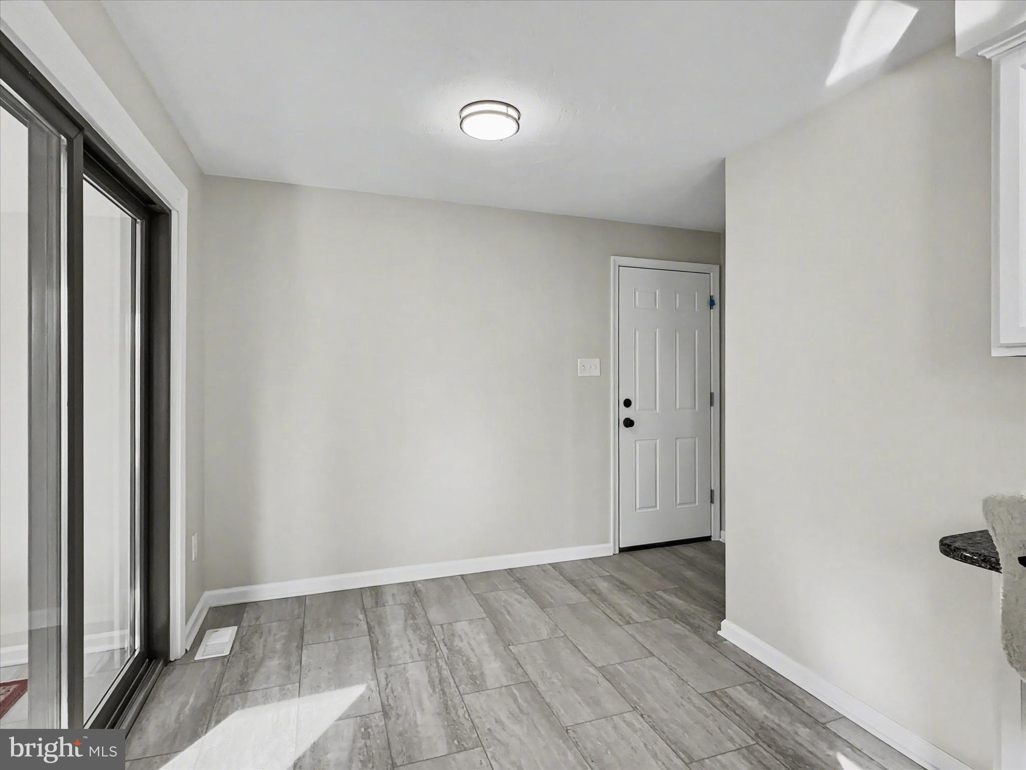610 Memory Lane Red Lion, PA 17356 - Photo 11 of 23 a view of an empty room with wooden floor and a window