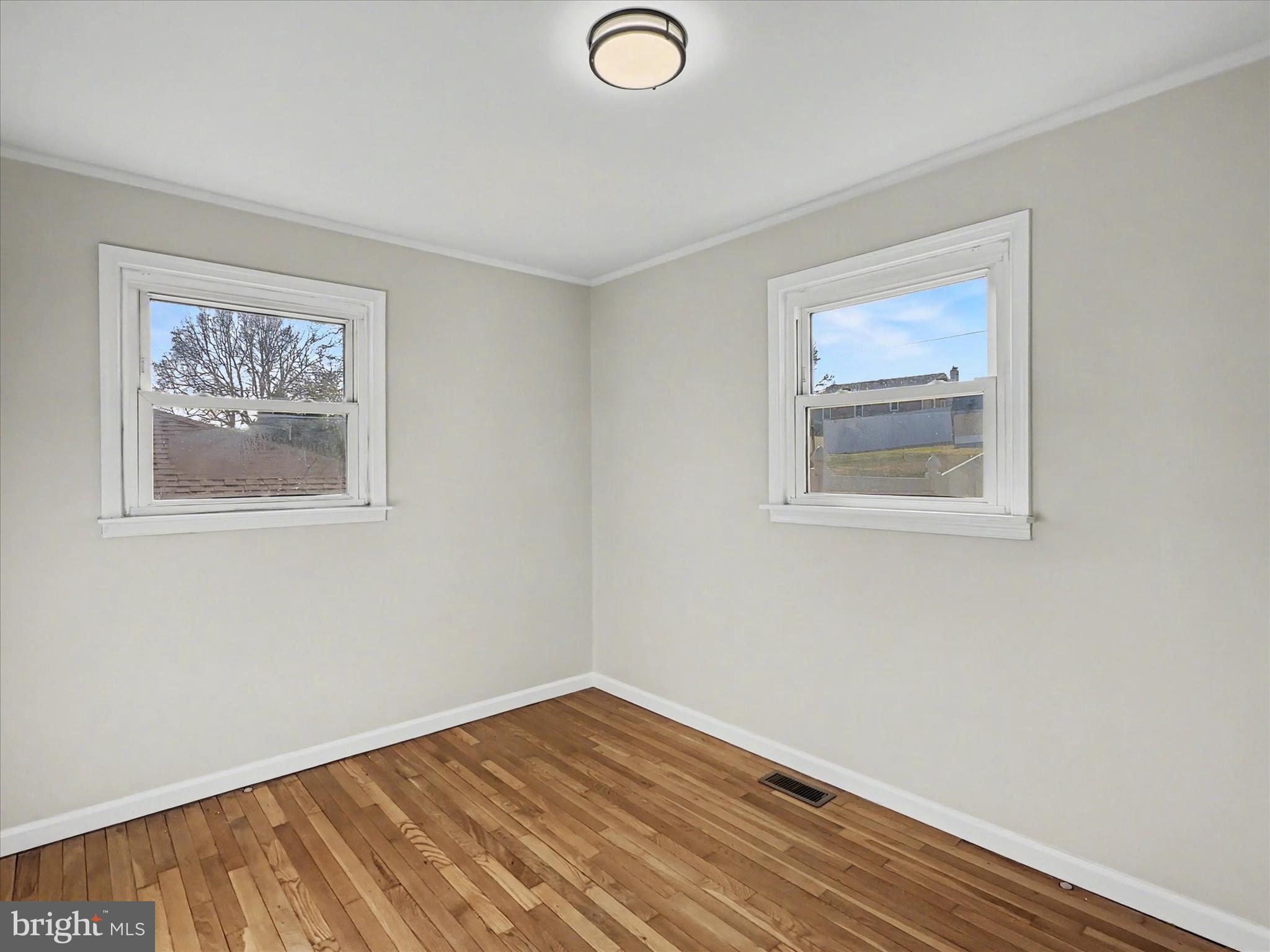 610 Memory Lane Red Lion, PA 17356 - Photo 16 of 23 a view of empty room with wooden floor
