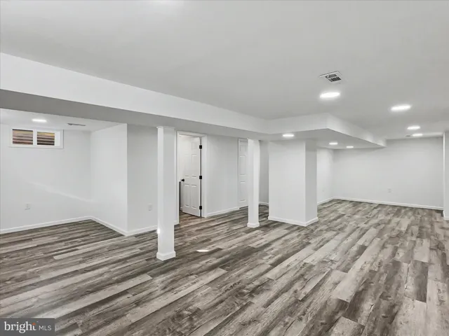 a view of a big room with wooden floor and closet