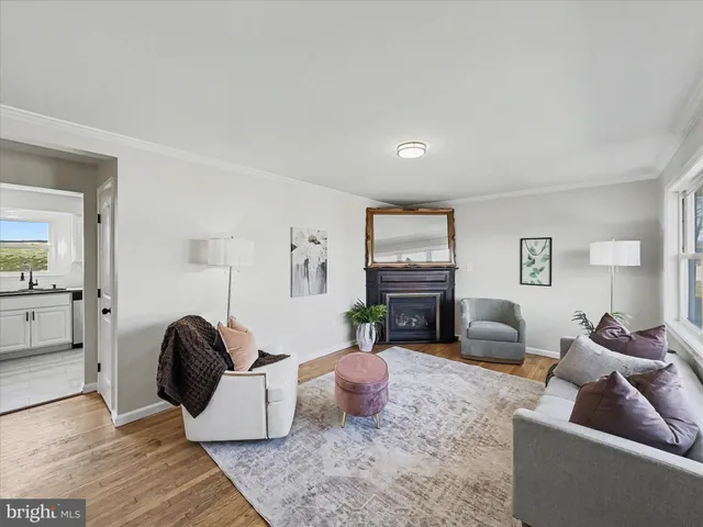 a living room with furniture fireplace and a flat screen tv