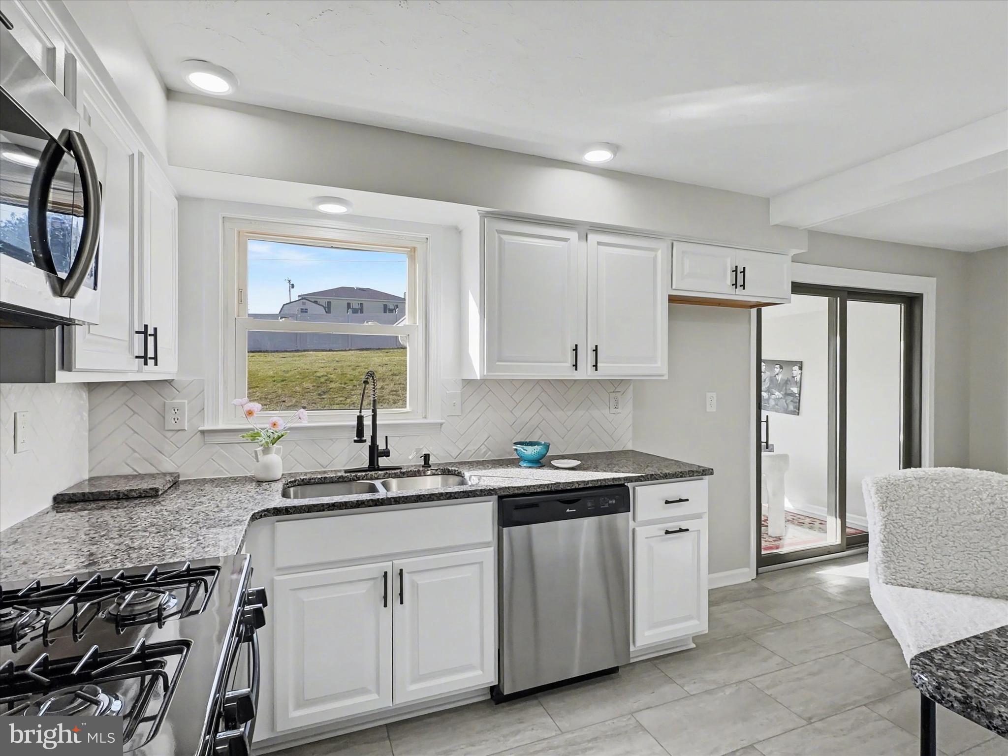 610 Memory Lane Red Lion, PA 17356 - Photo 5 of 23 a kitchen with a sink stove and cabinets