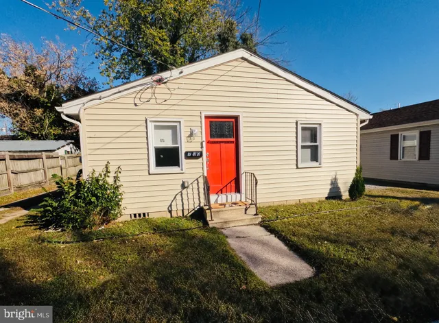 a view of backyard of house and wooden deck