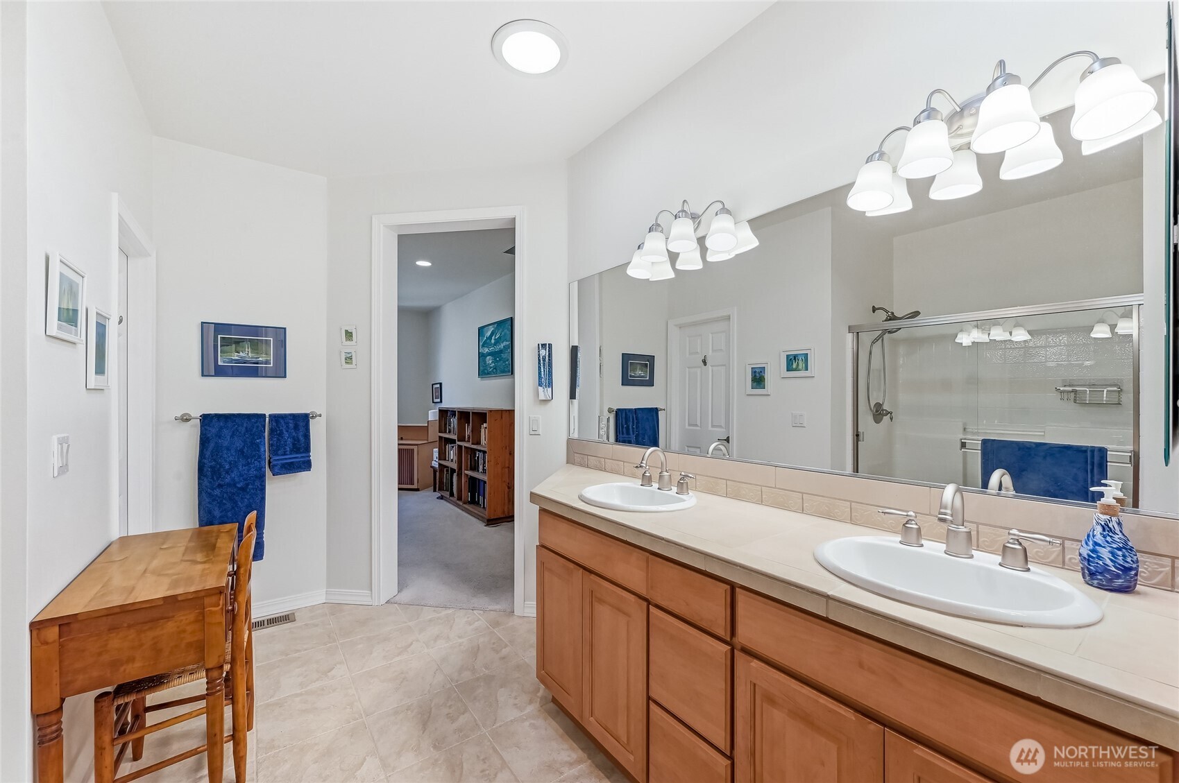 24264 Northeast Vine Maple Way Redmond, WA 98053 - Photo 14 of 31 a spacious bathroom with a sink double vanity granite and a large mirror