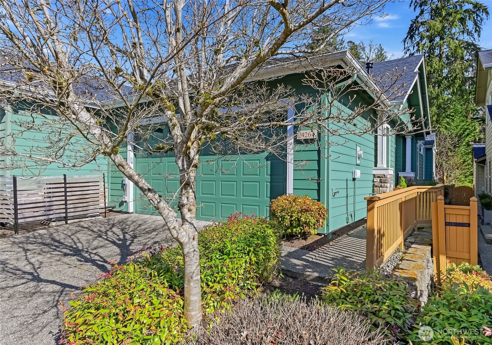 24264 Northeast Vine Maple Way Redmond, WA 98053 - Photo 2 of 31 a view of a chair and tables in the backyard