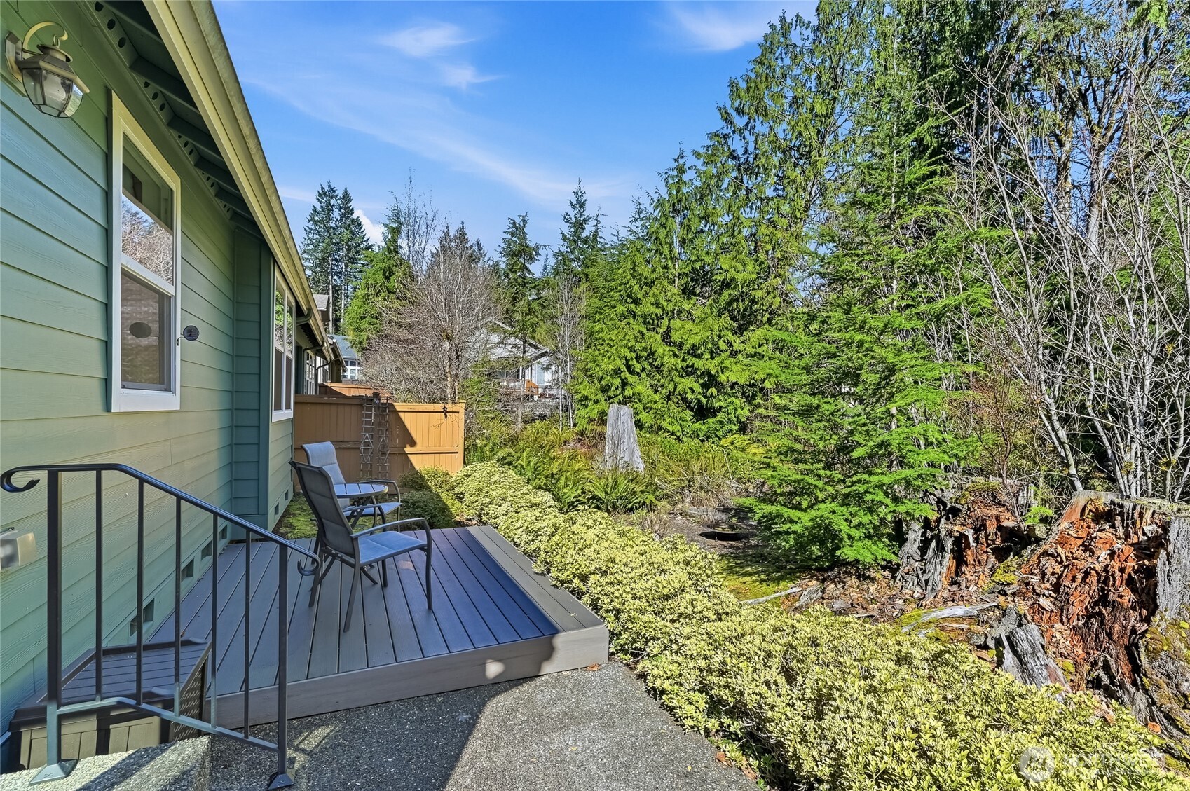 24264 Northeast Vine Maple Way Redmond, WA 98053 - Photo 22 of 31 a view of balcony with wooden floor and outdoor seating