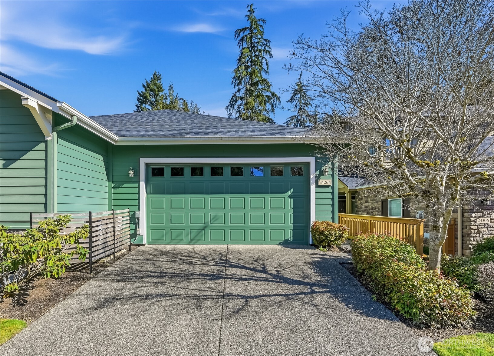 24264 Northeast Vine Maple Way Redmond, WA 98053 - Photo 30 of 31 a front view of a house with a garden
