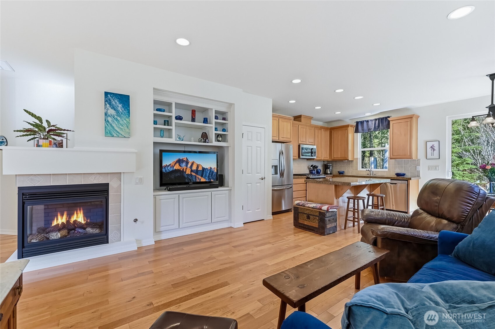 24264 Northeast Vine Maple Way Redmond, WA 98053 - Photo 5 of 31 a living room with furniture a fireplace and a flat screen tv
