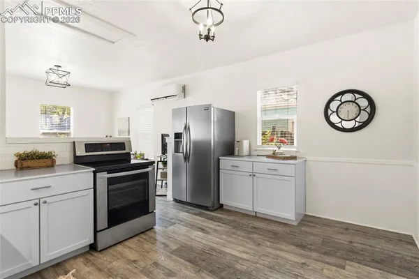 a kitchen with a refrigerator stove and sink