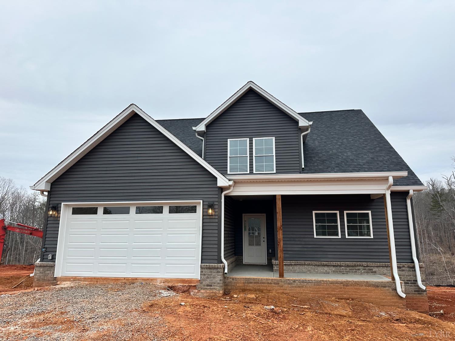 11250 Leesville Road Evington, VA 24550 - Photo 1 of 13 a front view of a house with garden