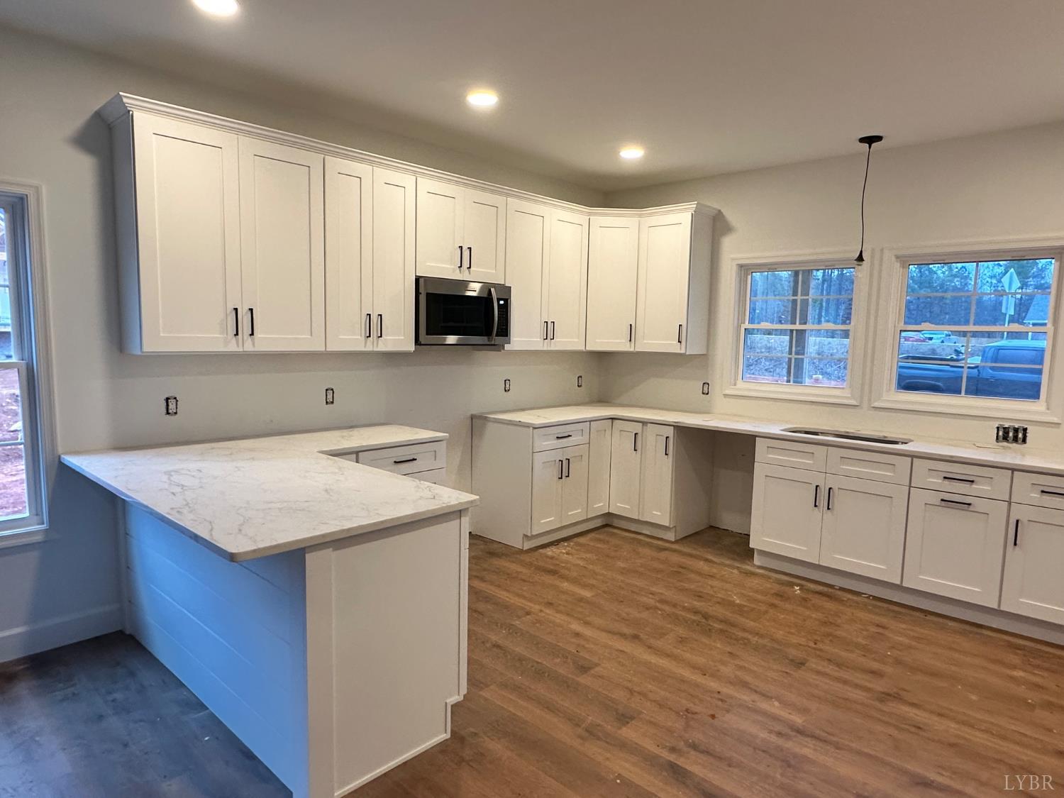 11250 Leesville Road Evington, VA 24550 - Photo 2 of 13 a kitchen with a stove window and cabinets