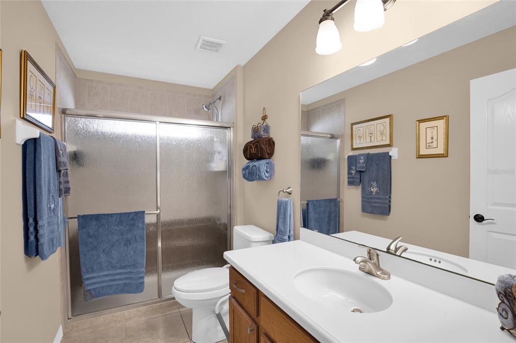 16411 Southwest 14th Avenue Road Ocala, FL 34473 - Photo 22 of 59 a bathroom with a sink toilet and shower