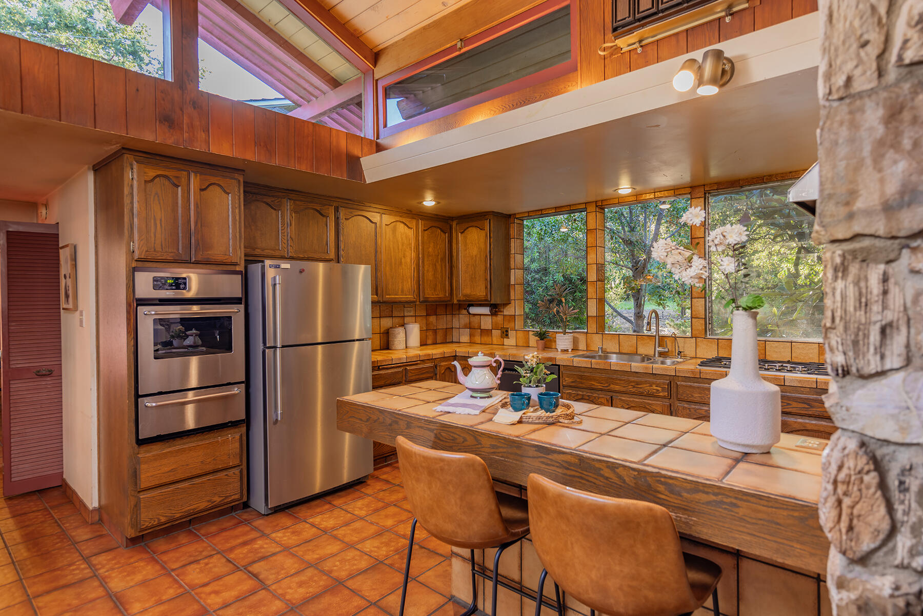 217 Sierra Road Ojai, CA 93023 - Photo 14 of 50 a dining room with furniture and a kitchen view