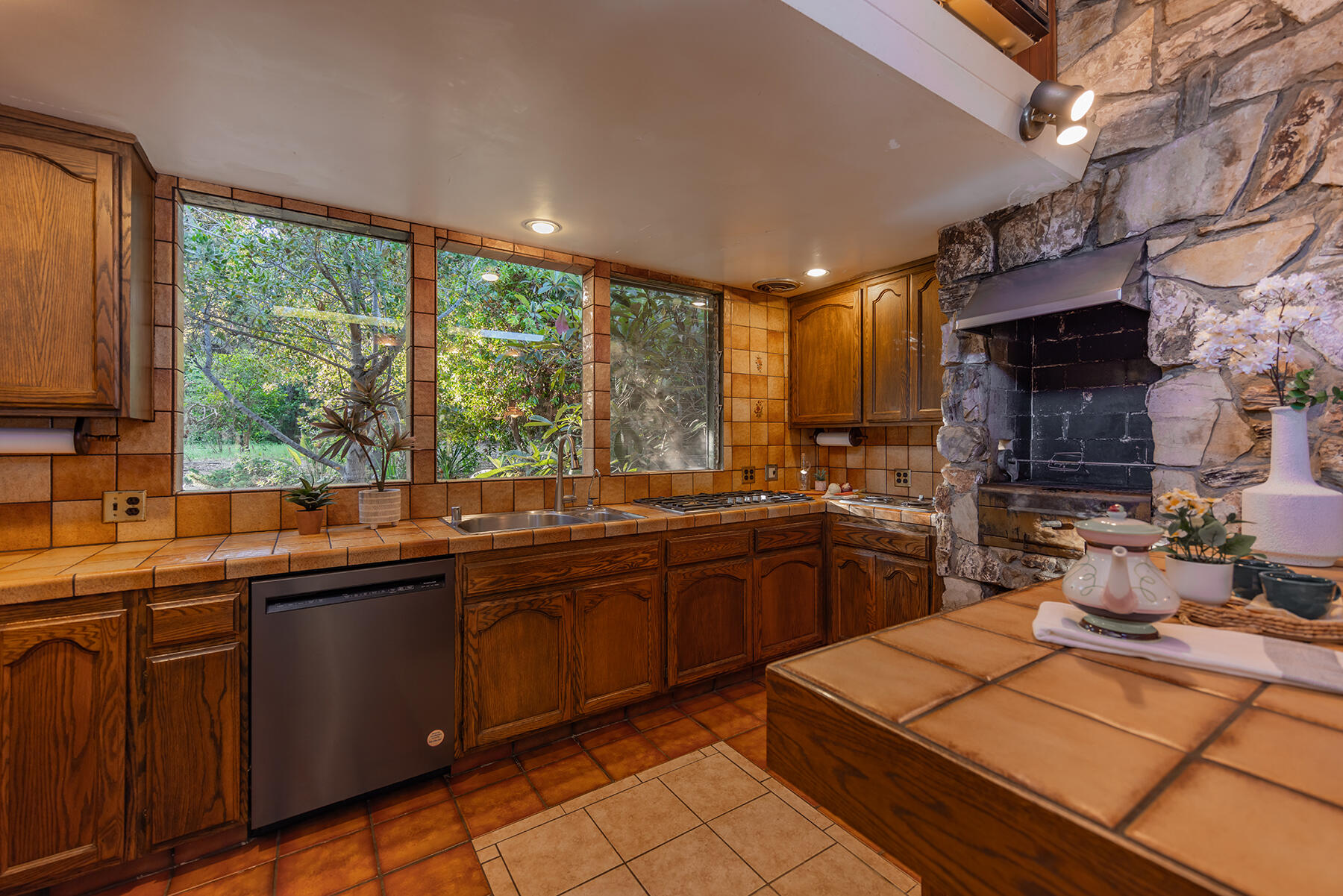 217 Sierra Road Ojai, CA 93023 - Photo 15 of 50 a kitchen with a sink and cabinets