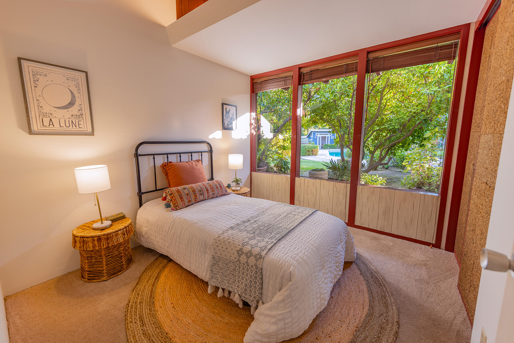 217 Sierra Road Ojai, CA 93023 - Photo 25 of 50 a bedroom with a bed and a large window