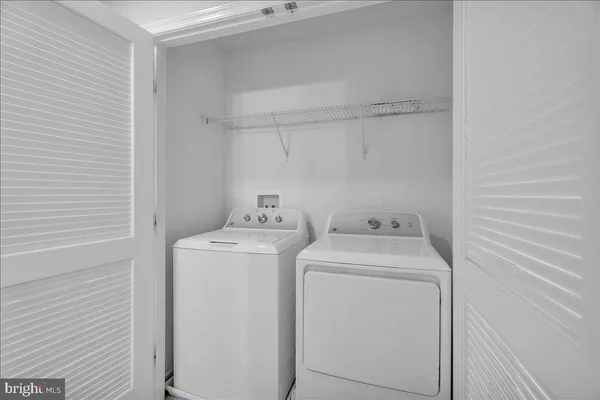 a bathroom with a granite countertop sink a toilet and a mirror