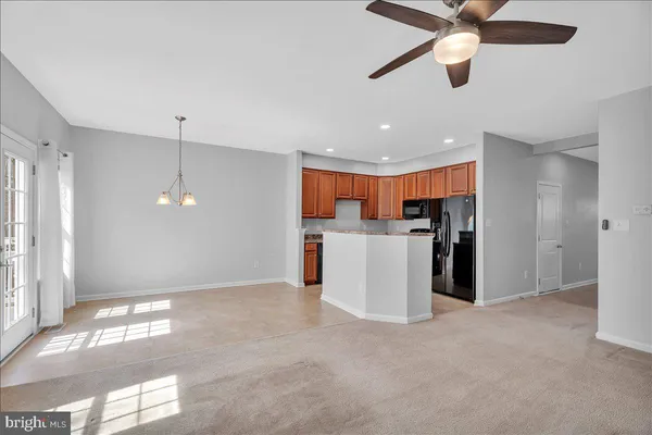 a view of a kitchen with a sink cabinets and a window
