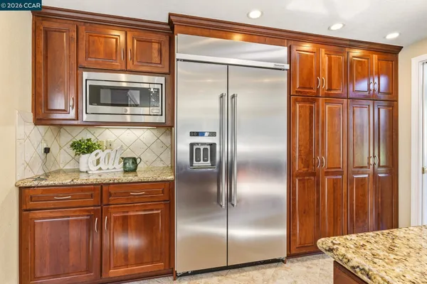 a kitchen with granite countertop a window and a sink
