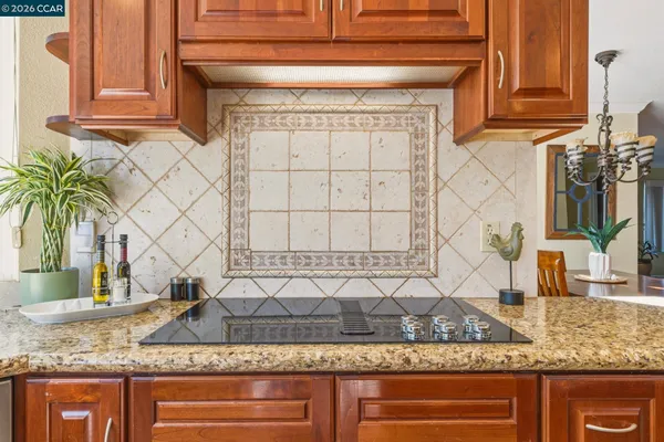 a kitchen with a table and chairs