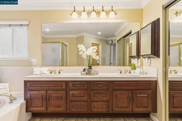 a bedroom with a bed and a chair