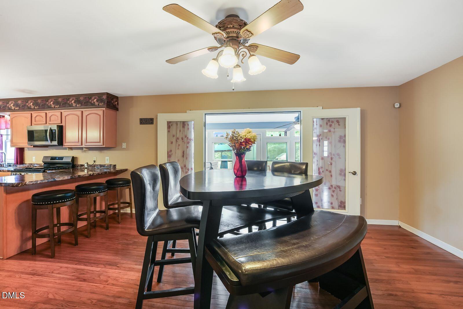 376-t K T K Allen Road Louisburg, NC 27549 - Photo 12 of 49 a view of a dining room with furniture and wooden floor