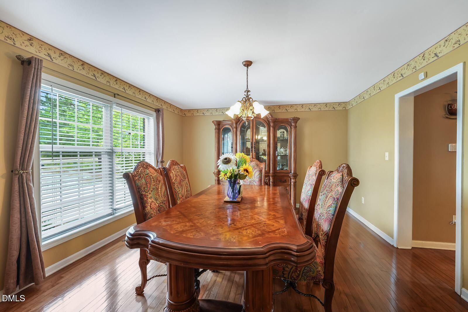 376-t K T K Allen Road Louisburg, NC 27549 - Photo 13 of 49 a view of a dining room with furniture window and wooden floor