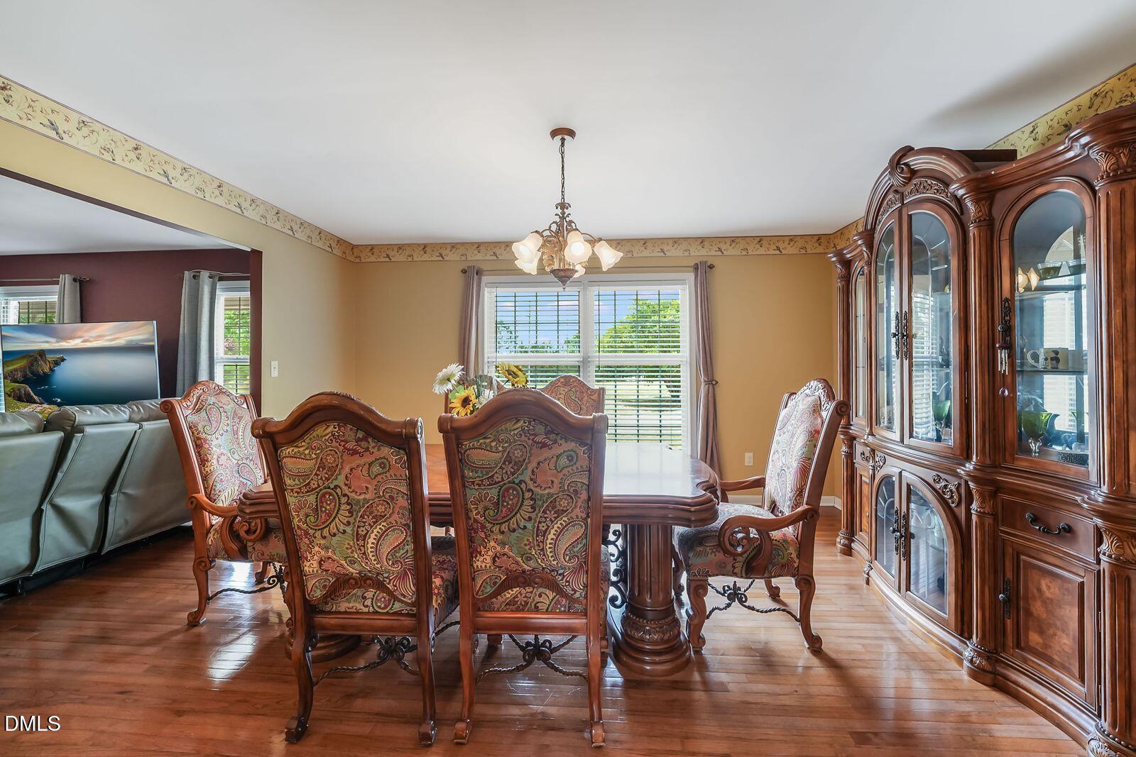 376-t K T K Allen Road Louisburg, NC 27549 - Photo 14 of 49 a view of a dining room with furniture window and wooden floor