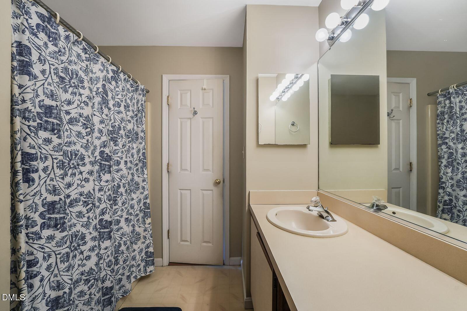 376-t K T K Allen Road Louisburg, NC 27549 - Photo 18 of 49 a bathroom with a sink and a mirror