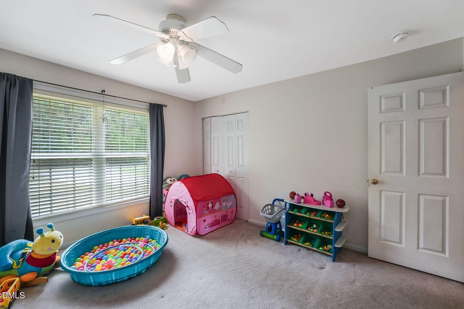 376-t K T K Allen Road Louisburg, NC 27549 - Photo 20 of 49 a bedroom with furniture and a window