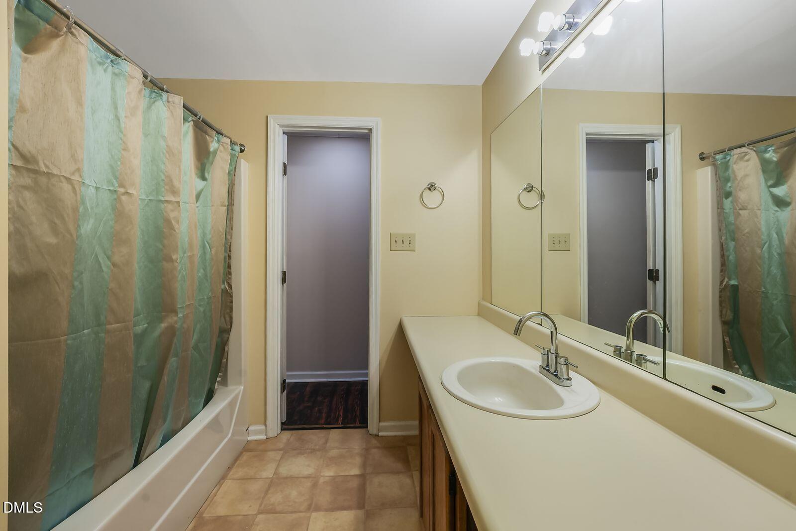 376-t K T K Allen Road Louisburg, NC 27549 - Photo 30 of 49 a bathroom with a sink and a mirror