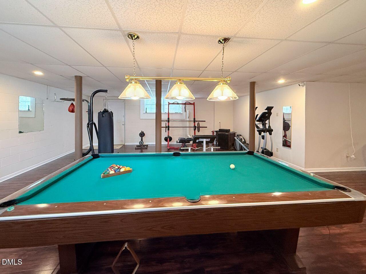 376-t K T K Allen Road Louisburg, NC 27549 - Photo 35 of 49 a room with pool table two windows and a chandelier