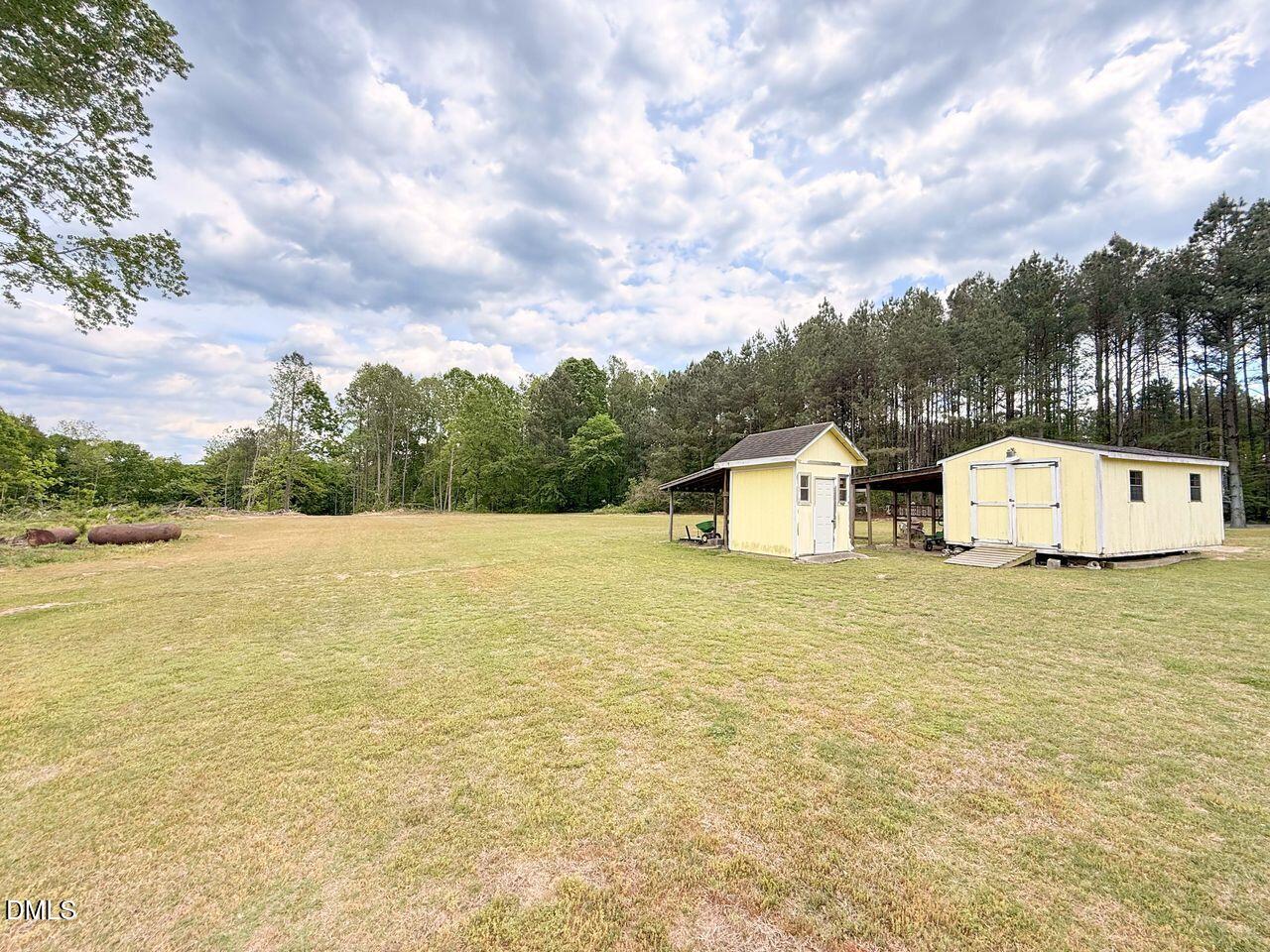 376-t K T K Allen Road Louisburg, NC 27549 - Photo 40 of 49 a house with a field and trees in the background