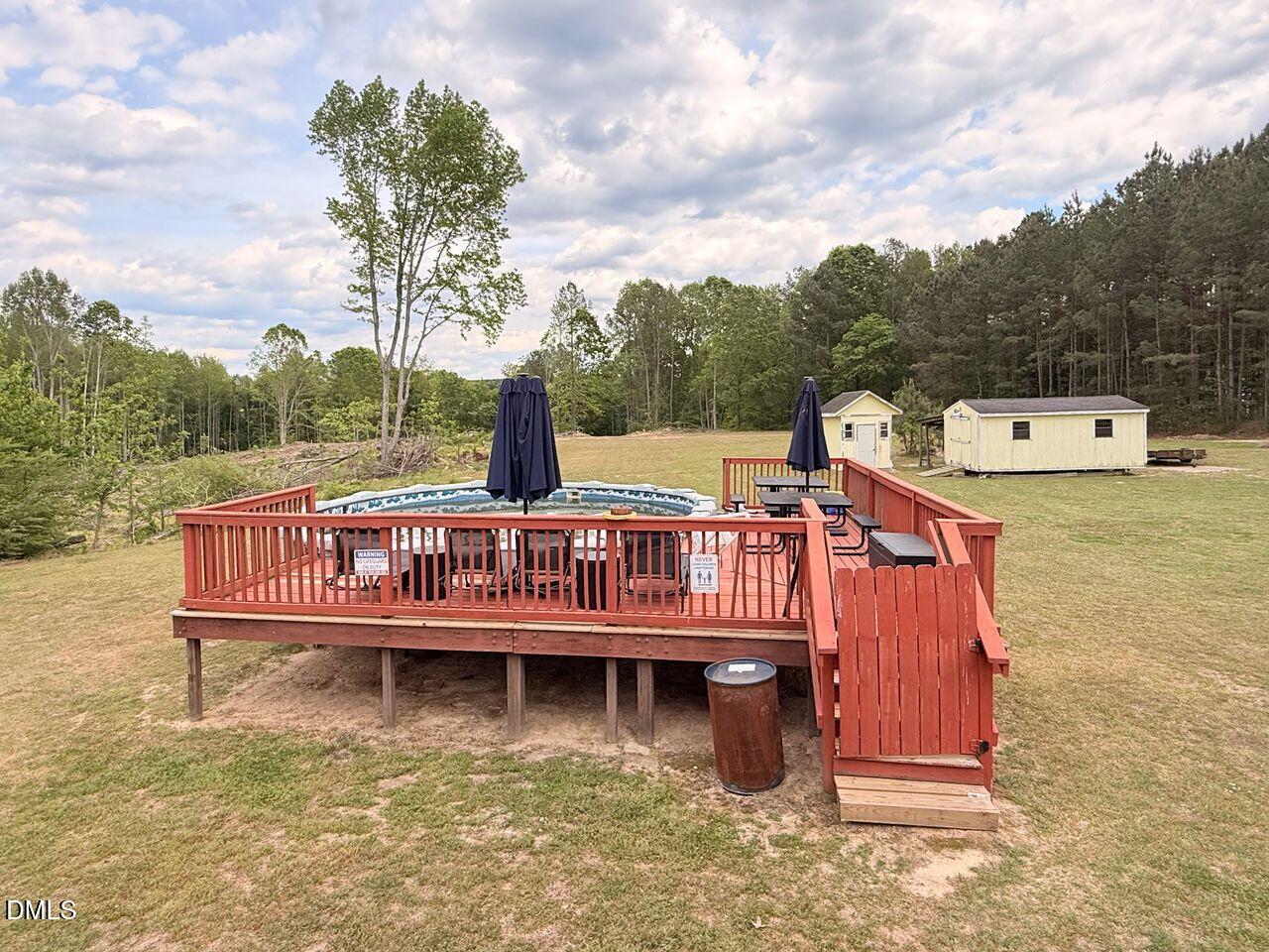 376-t K T K Allen Road Louisburg, NC 27549 - Photo 43 of 49 a view of a wooden deck with a lake view