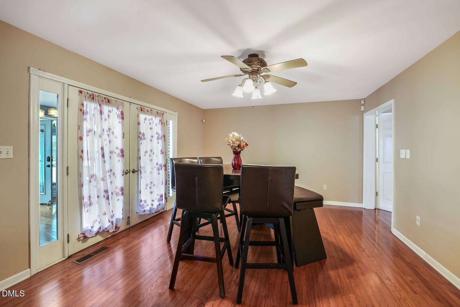 376-t K T K Allen Road Louisburg, NC 27549 - Photo 10 of 49 a view of a dining room with furniture window and wooden floor