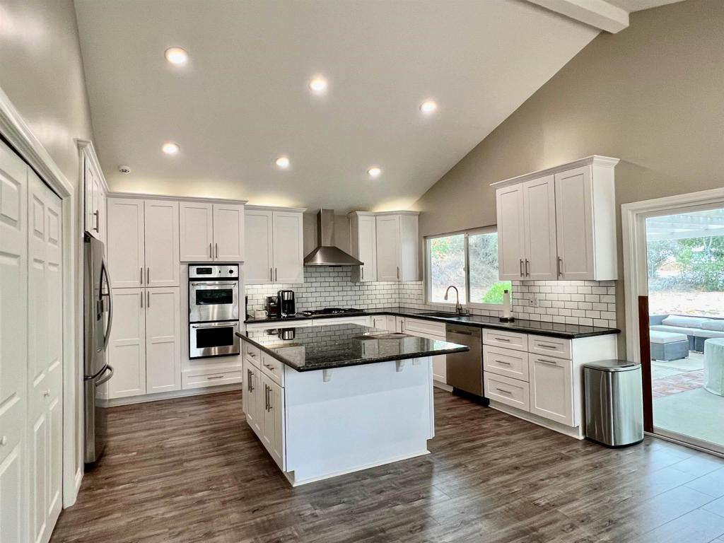 1816 Gird Road Fallbrook, CA 92028 - Photo 1 of 1 a kitchen with stainless steel appliances granite countertop a refrigerator and a stove top oven