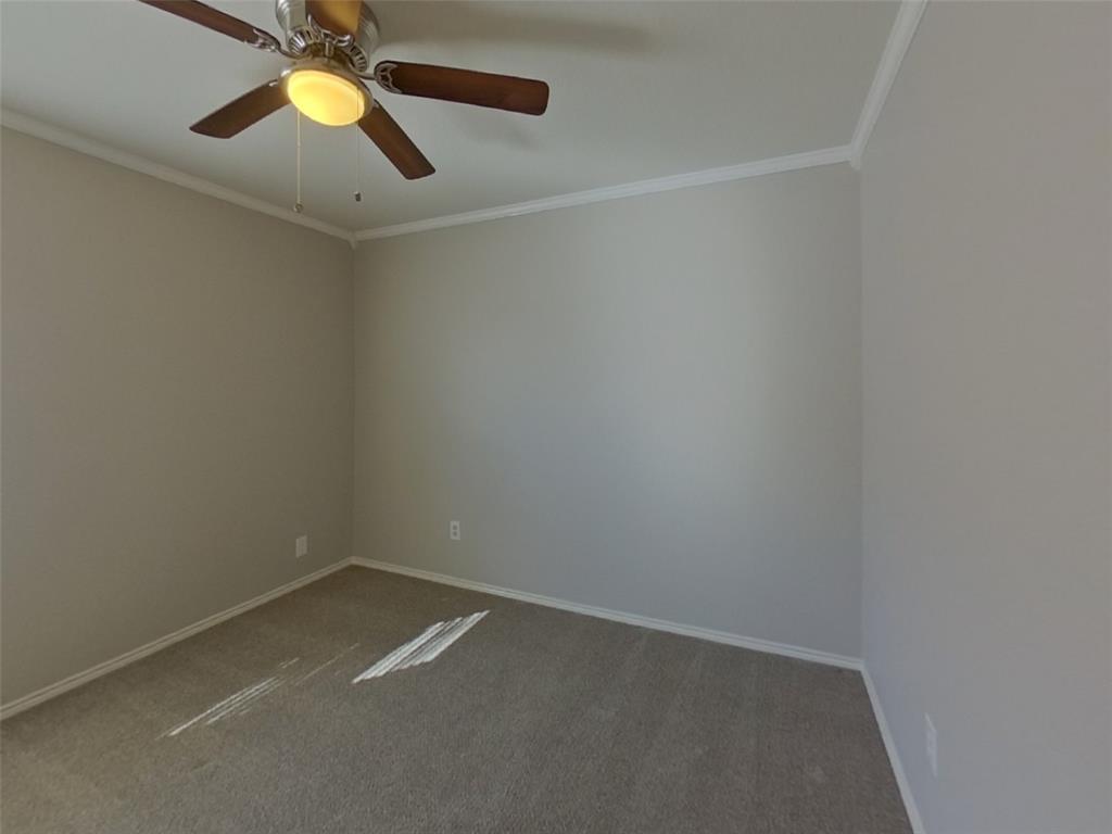 1448 Castle Ridge Road Fort Worth, TX 76140 - Photo 10 of 16 an empty room with a window and a ceiling fan