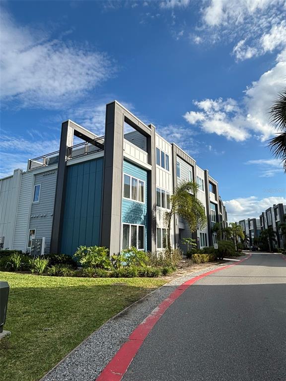 a view of a house with backyard and tree s