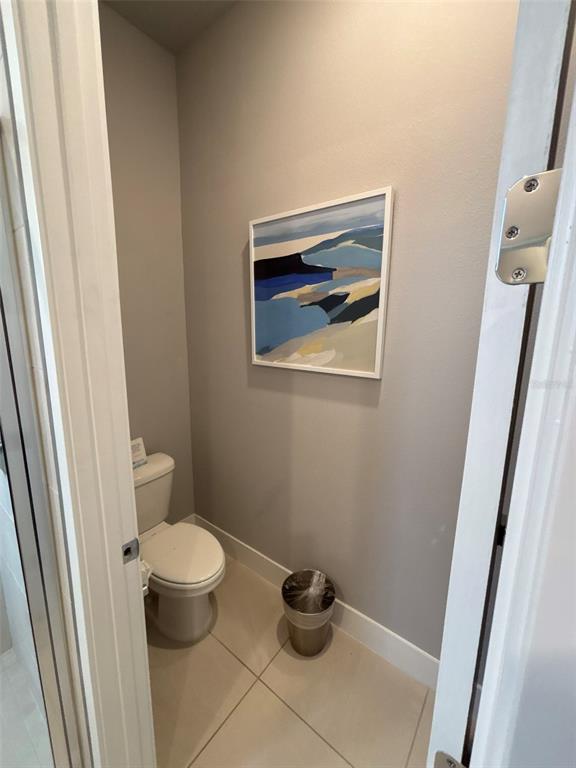 7740 Sandy Ridge Drive, Unit 131 Reunion, FL 34747 - Photo 13 of 27 a bathroom with a toilet and a sink