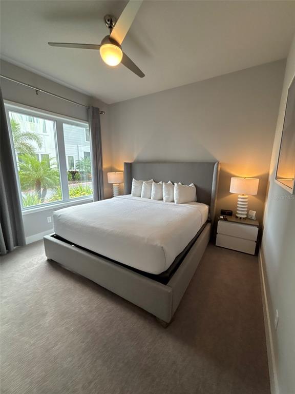 7740 Sandy Ridge Drive, Unit 131 Reunion, FL 34747 - Photo 14 of 27 a bedroom with a bed and window