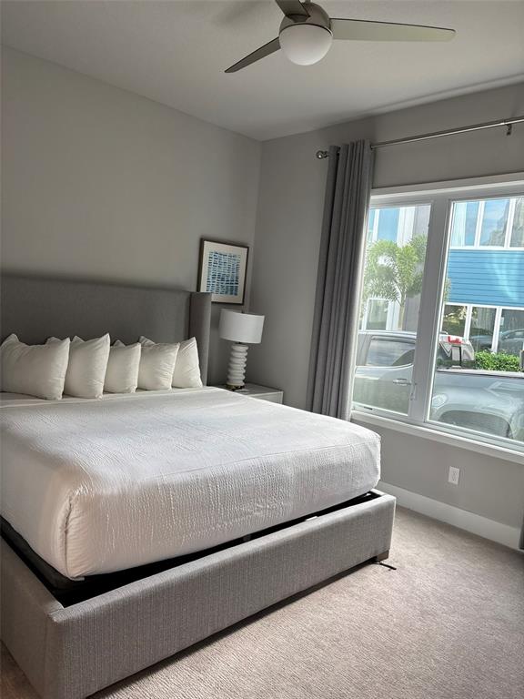 7740 Sandy Ridge Drive, Unit 131 Reunion, FL 34747 - Photo 15 of 27 a bedroom with a bed and window