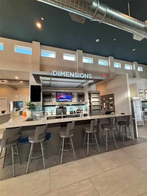 7740 Sandy Ridge Drive, Unit 131 Reunion, FL 34747 - Photo 20 of 27 a group of people sitting in a room