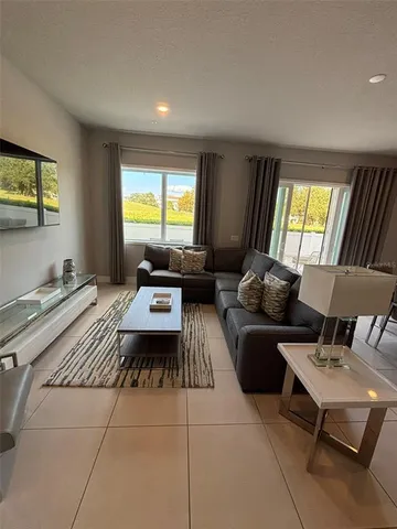 a living room with furniture and a window