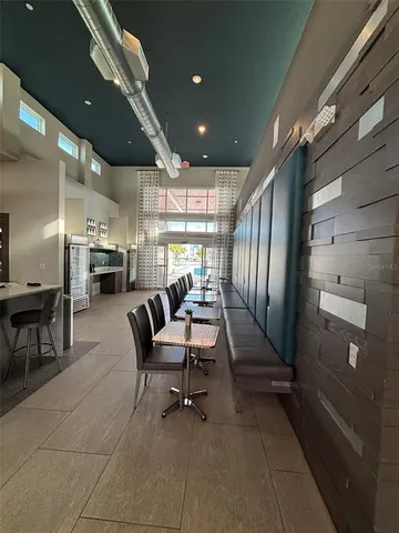 a room with lots of furniture and a table