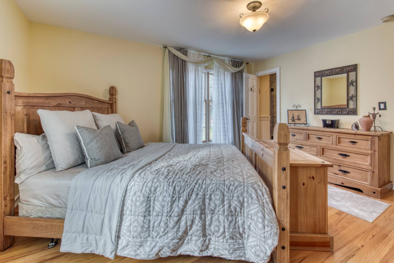 1532 Noyack Road Southampton, NY 11968 - Photo 11 of 15 a bed room with a bed and a television