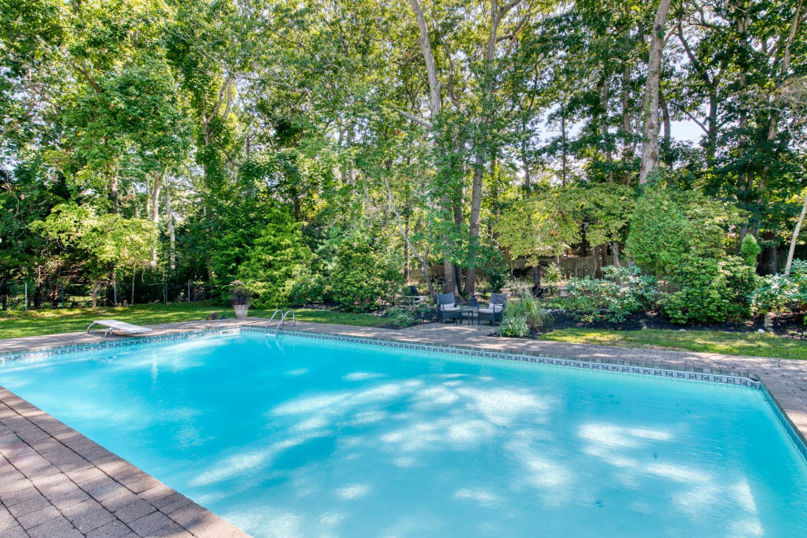 1532 Noyack Road Southampton, NY 11968 - Photo 13 of 15 a view of a tennis ground with large trees