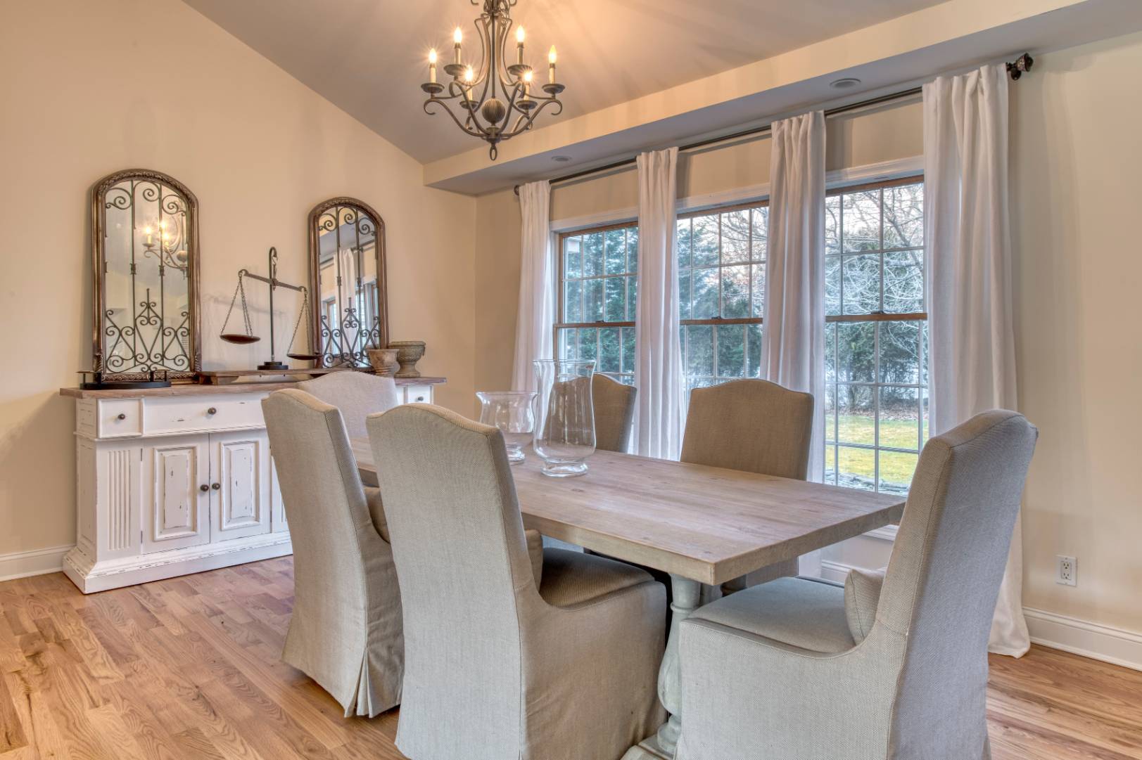 1532 Noyack Road Southampton, NY 11968 - Photo 3 of 15 a view of a dining room with furniture window and wooden floor