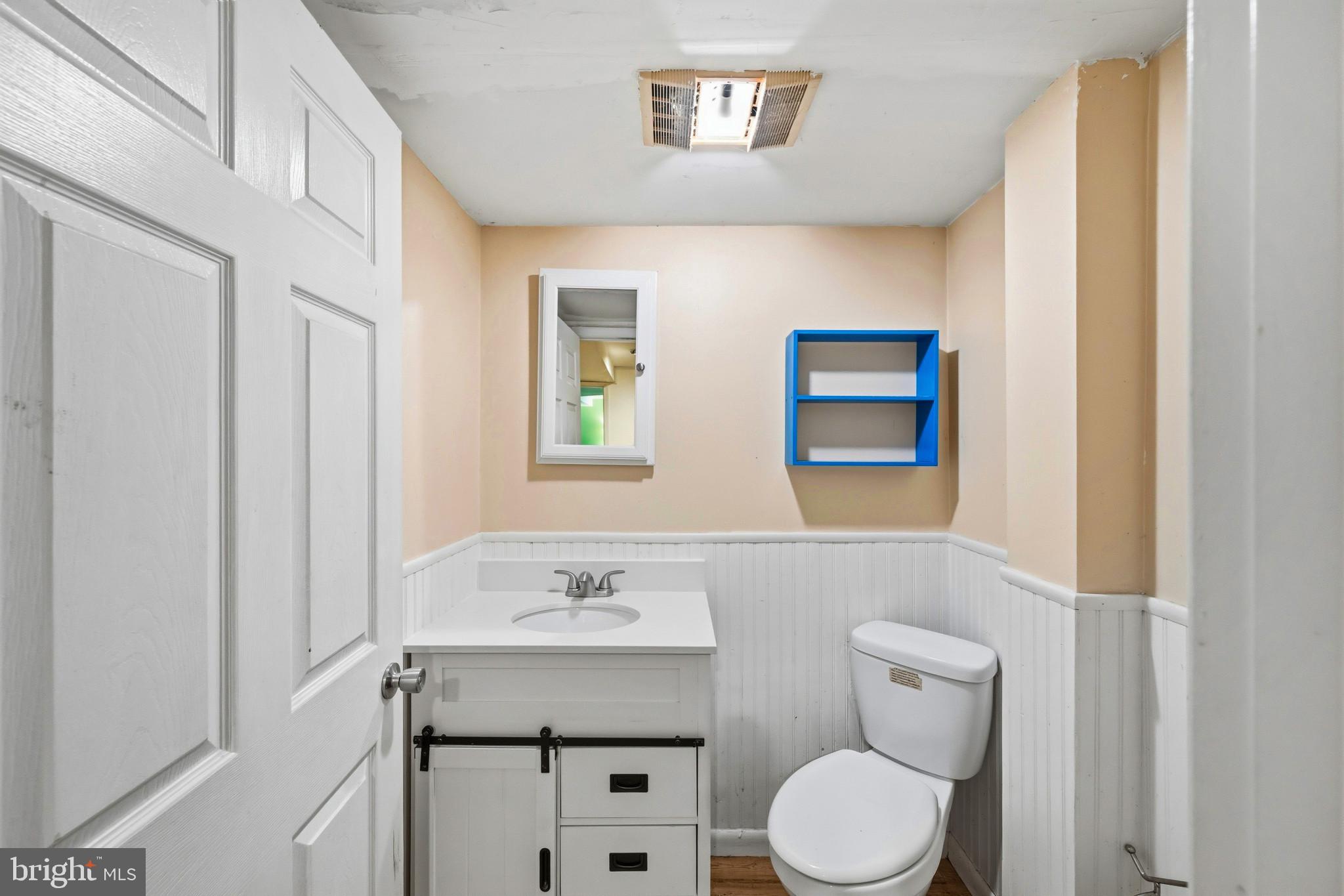2702 Bird View Road Westminster, MD 21157 - Photo 30 of 41 a bathroom with a toilet a sink and mirror
