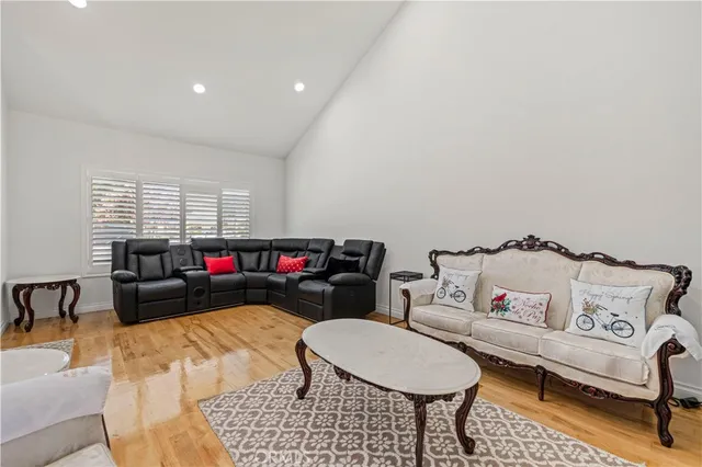 a dining room with furniture and wooden floor